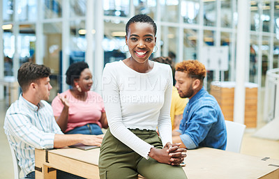 Buy stock photo Shot of a young businesswoman having a meeting with her team in a modern office