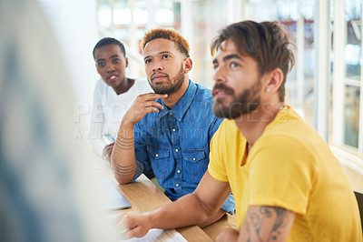 Buy stock photo Shot of a group of young businesspeople having a meeting in a modern office