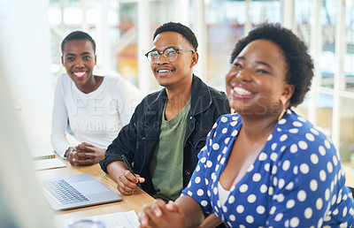 Buy stock photo Shot of a group of young businesspeople having a meeting in a modern office