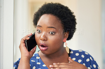 Buy stock photo Shot of a young businesswoman looking shocked while using a smartphone in a modern office