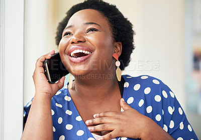 Buy stock photo Shot of a happy young businesswoman using a smartphone in a modern office