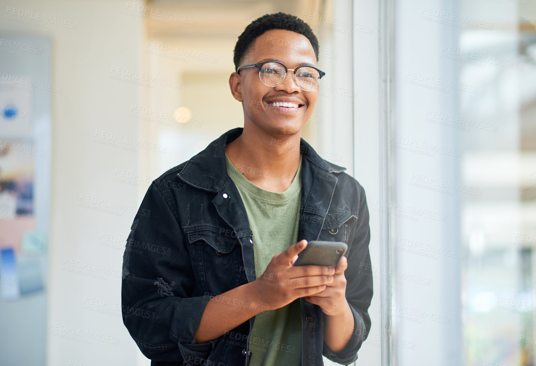 Buy stock photo Phone, smile and businessman thinking for social media, message or online in office for internet laughing at meme. Funny, searching and designer employee browsing website or mobile app on smartphone
