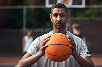Buy stock photo Portrait of a sporty young man standing on a basketball court