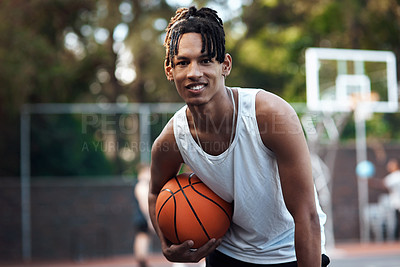 Buy stock photo Portrait of a sporty young man standing on a basketball court