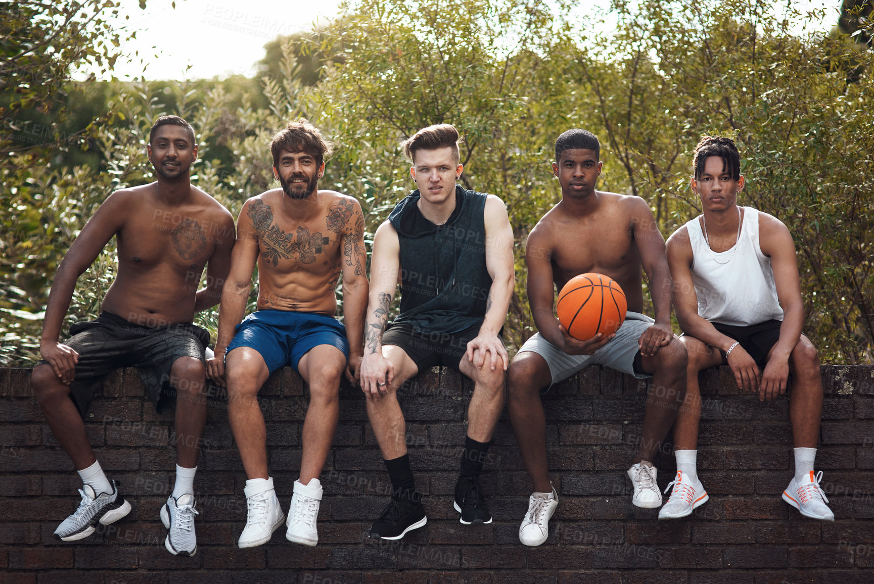 Buy stock photo Basketball, team and portrait with friends on wall for sports, exercise or training break outdoors. Athlete, people and relax together for bonding, hobby and rest from practice or game on court