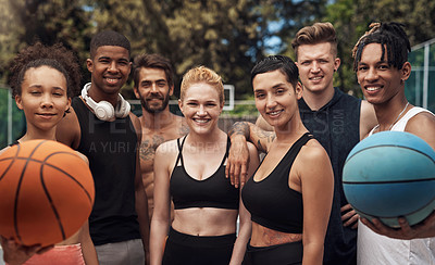 Buy stock photo Portrait of a group of sporty young people standing together on a sports court