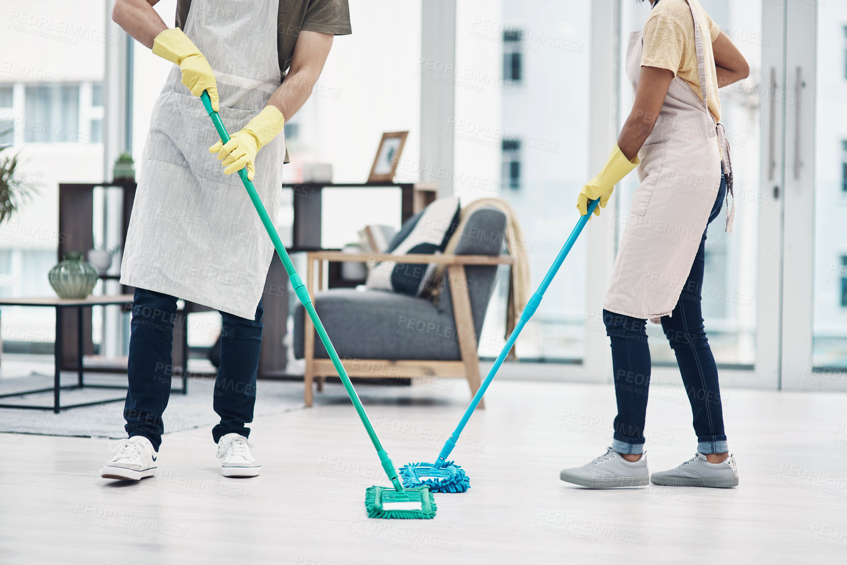 Buy stock photo People, housekeeping and cleaning floor with mop for disinfection, hygiene or tidying at home. Cleaner, maid or couple with equipment, gloves or scrub on surface for bacteria or germ removal at house