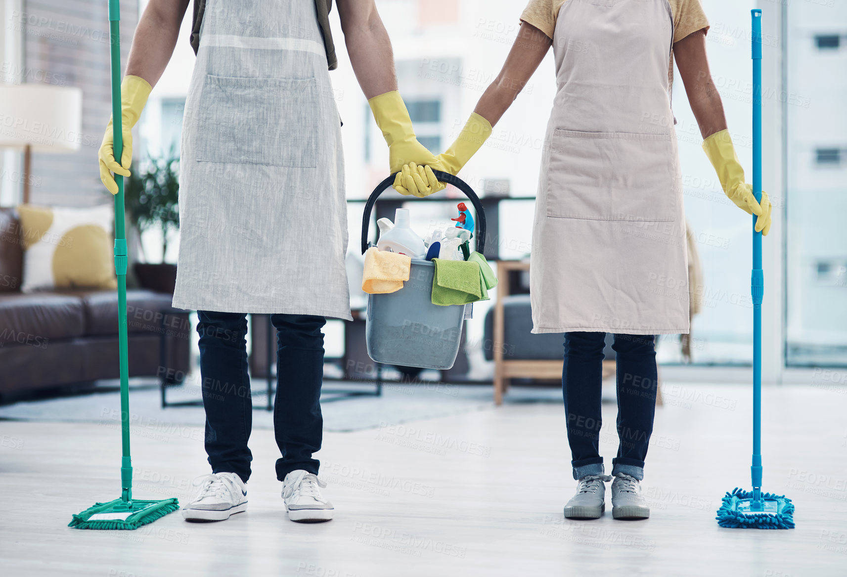 Buy stock photo Shot of an unrecognisable couple mopping the floor together at home