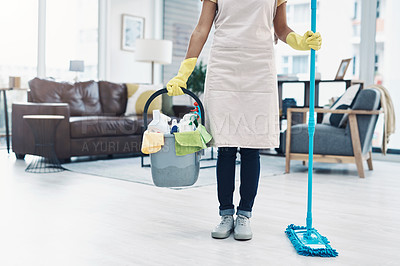 Buy stock photo Shot of an unrecognisable woman mopping the floor at home