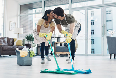 Buy stock photo Happy couple, kiss and cleaning floor with mop for housekeeping, disinfection or tidying at home. Man, woman or lovers with affection, equipment or supplies for teamwork, bacteria or germ removal