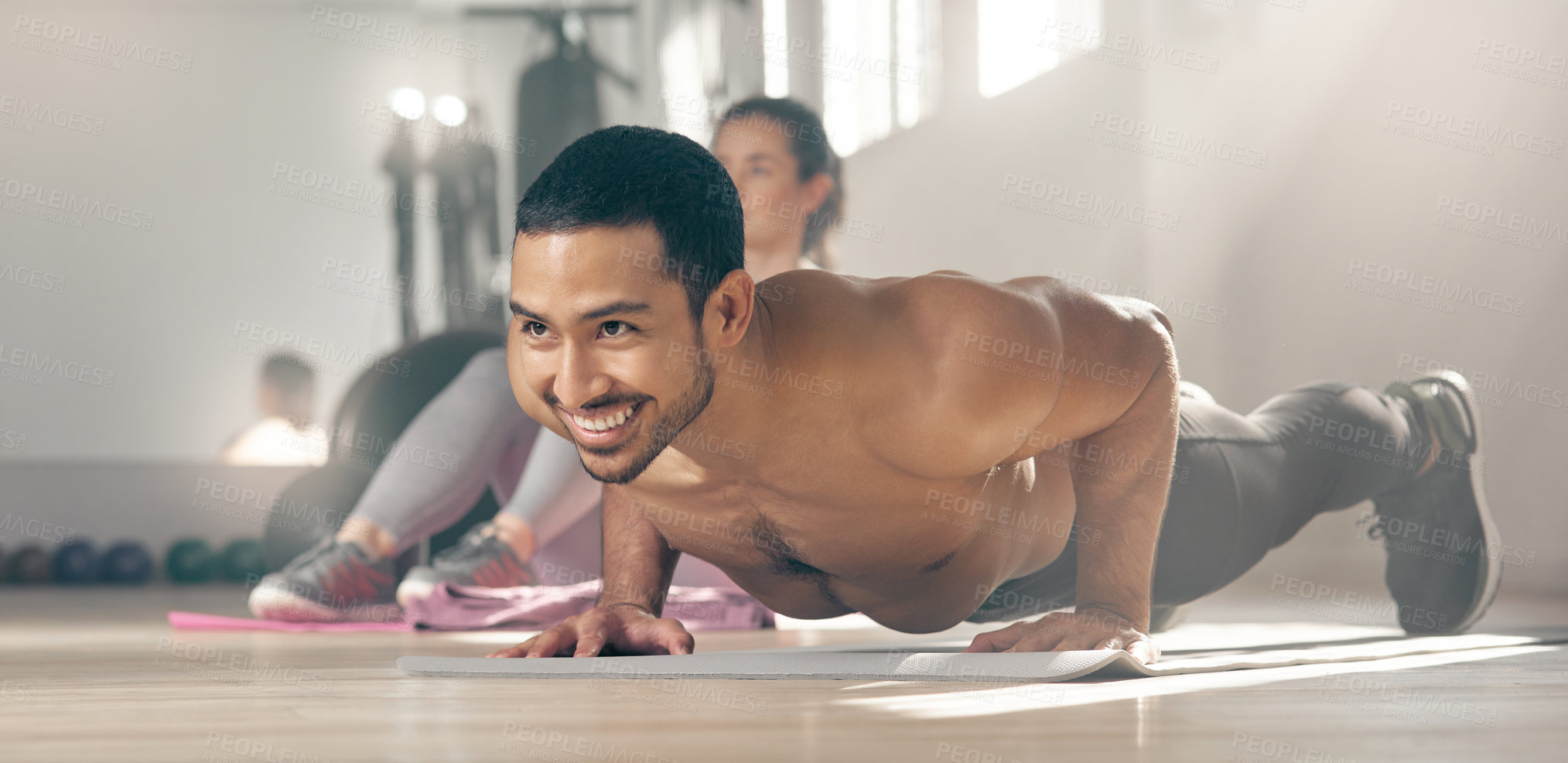 Buy stock photo Shot of a young male athlete working out at the gym