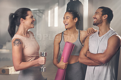 Buy stock photo Cropped shot of three young athletes standing together at the gym