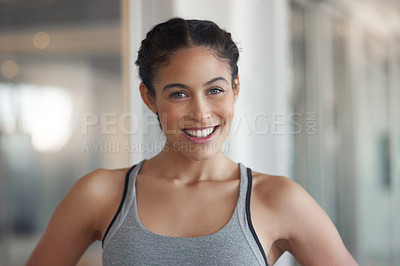 Buy stock photo Cropped shot of a beautiful young athlete standing in the gym