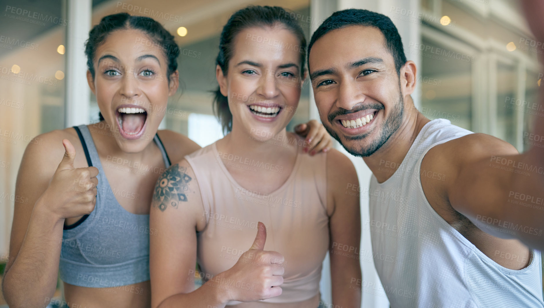 Buy stock photo Shot of three young athletes taking a selfie while standing together in the gym