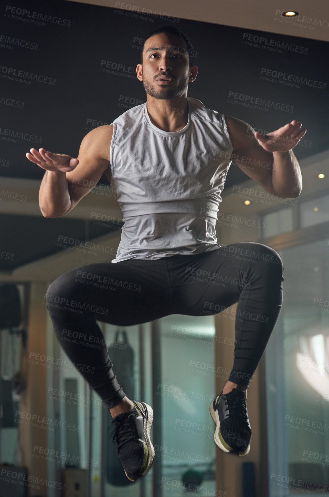 Buy stock photo Workout, jumping and cardio with man in gym for exercise, muscle and health. Fitness class, energy and sports center  with male person training in studio for wellness, athlete and power challenge