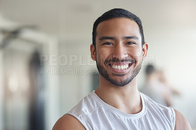Buy stock photo Cropped portrait of a handsome young male athlete standing in the gym
