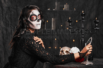 Buy stock photo Cropped portrait of an attractive young woman dressed in her Mexican-style halloween costume looking in a mirror