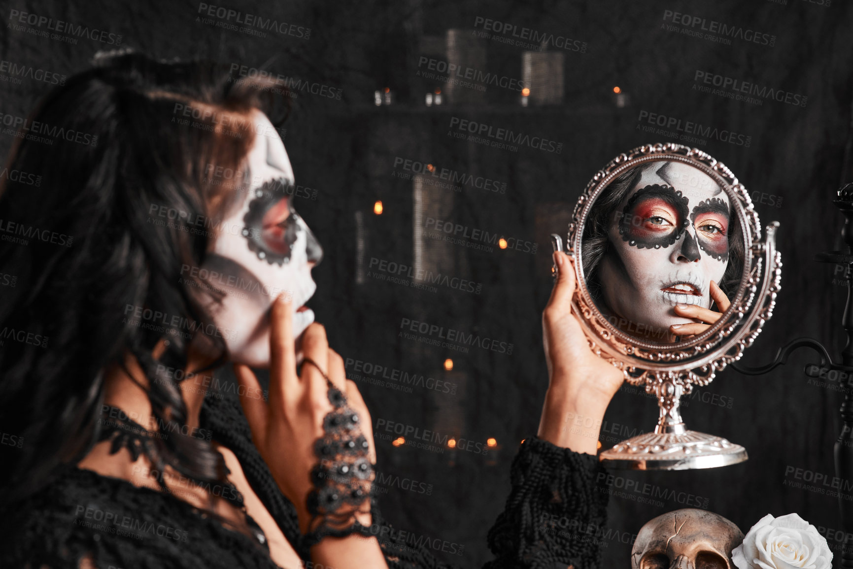Buy stock photo Cropped shot of an attractive young woman dressed in her Mexican-style halloween costume looking in a mirror
