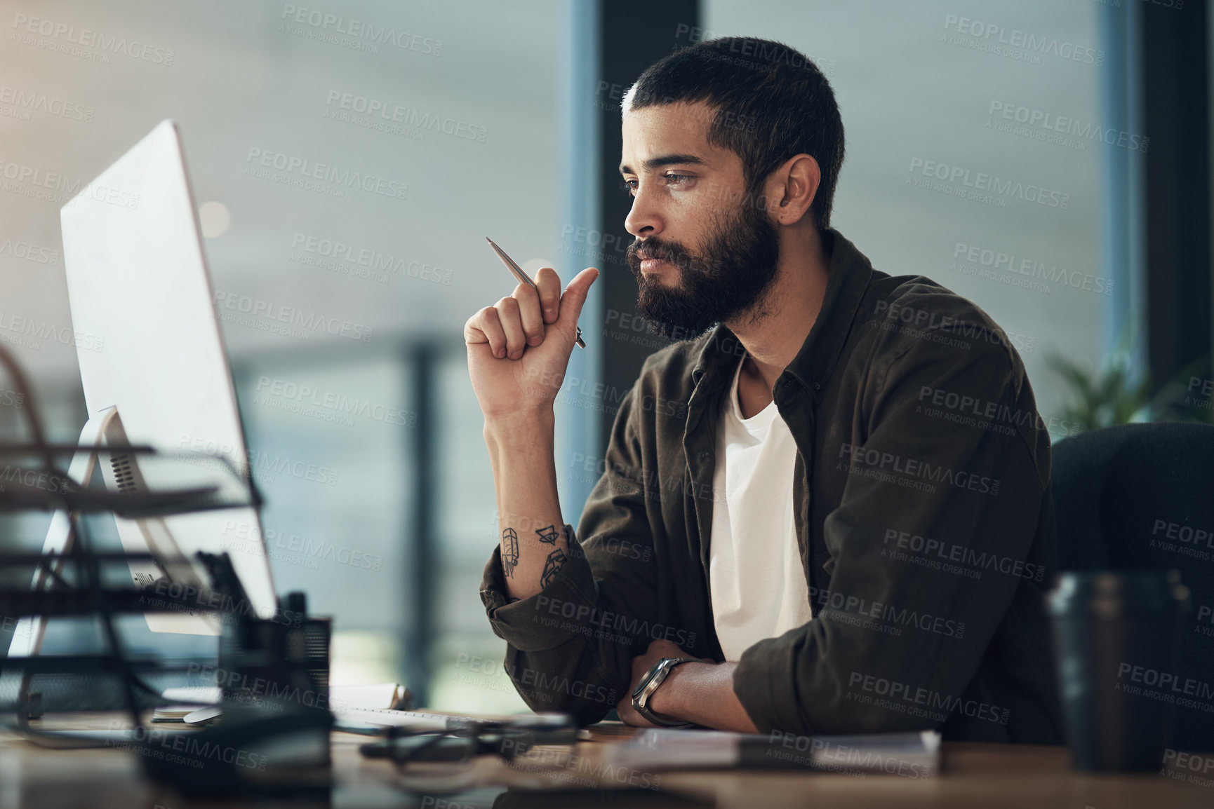 Buy stock photo Creative, man or graphic designer reading on computer in startup for online layout update or project report. Night, technology or person in media agency for homepage ideas, research or development