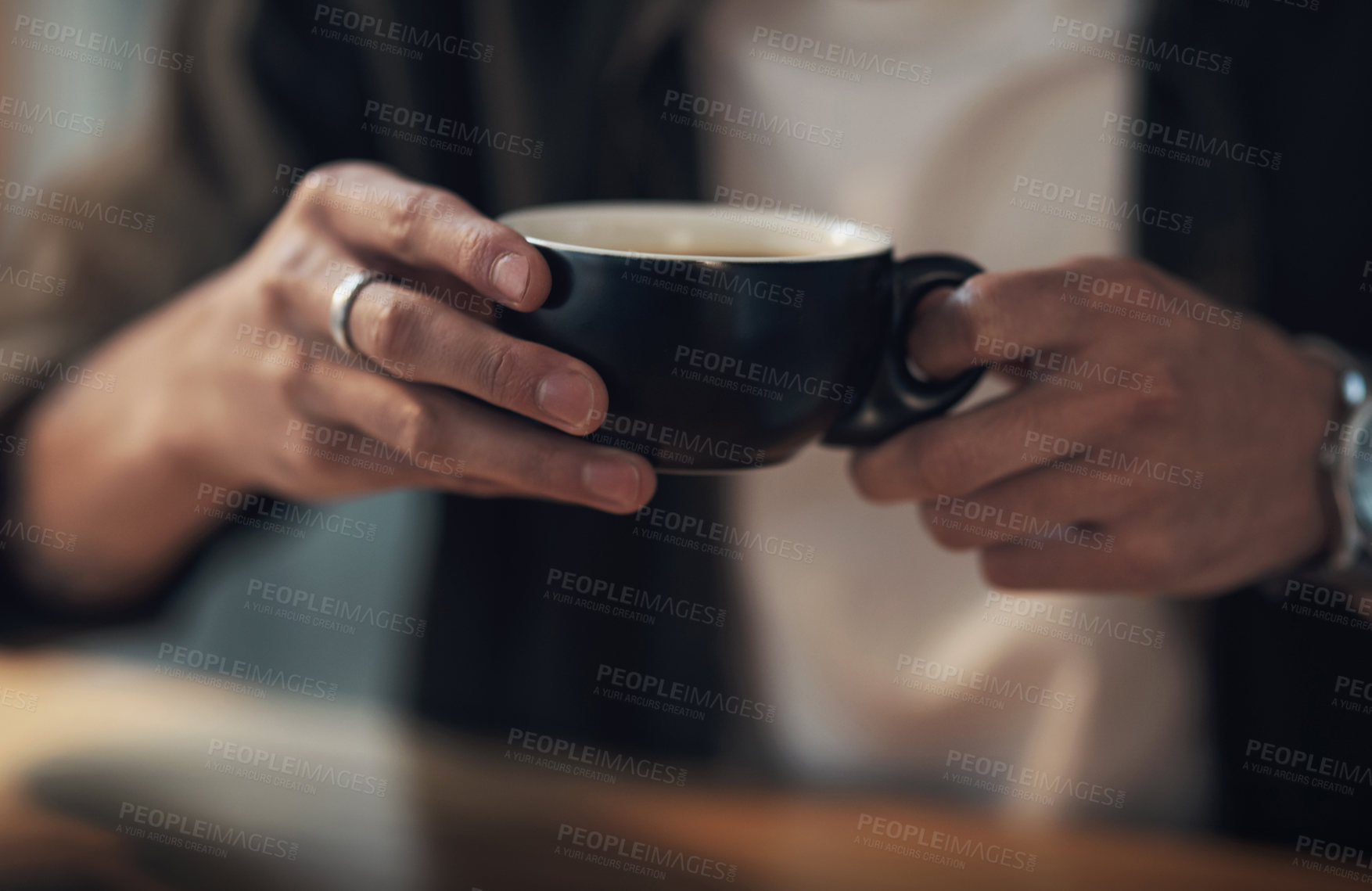 Buy stock photo Shot of an unrecognisable businessman having a coffee break during a late night in a modern office
