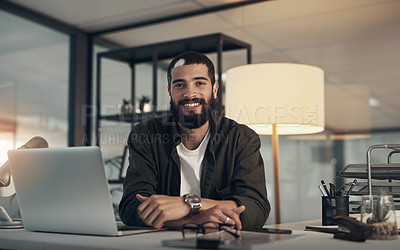 Buy stock photo Shot of a young man using a microphone and laptop during a late night at work