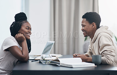 Buy stock photo Shot of a happy young couple working from home