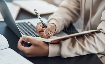 Buy stock photo Closeup, hands and man writing in a notebook, remote work from home and planning with schedule, laptop or connection. Male person, freelancer or entrepreneur with a diary, journal or creative project