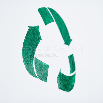 Buy stock photo Shot of a green recycle symbol painted on a wall