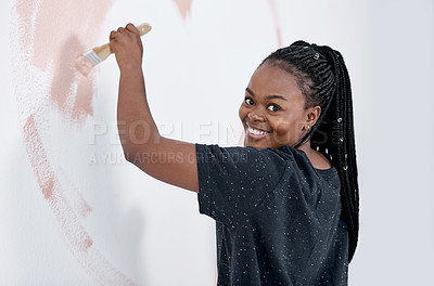 Buy stock photo Shot of a young woman painting a wall pink