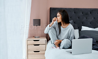 Buy stock photo Shot of a young woman looking thoughtful while recovering from an illness in bed at home