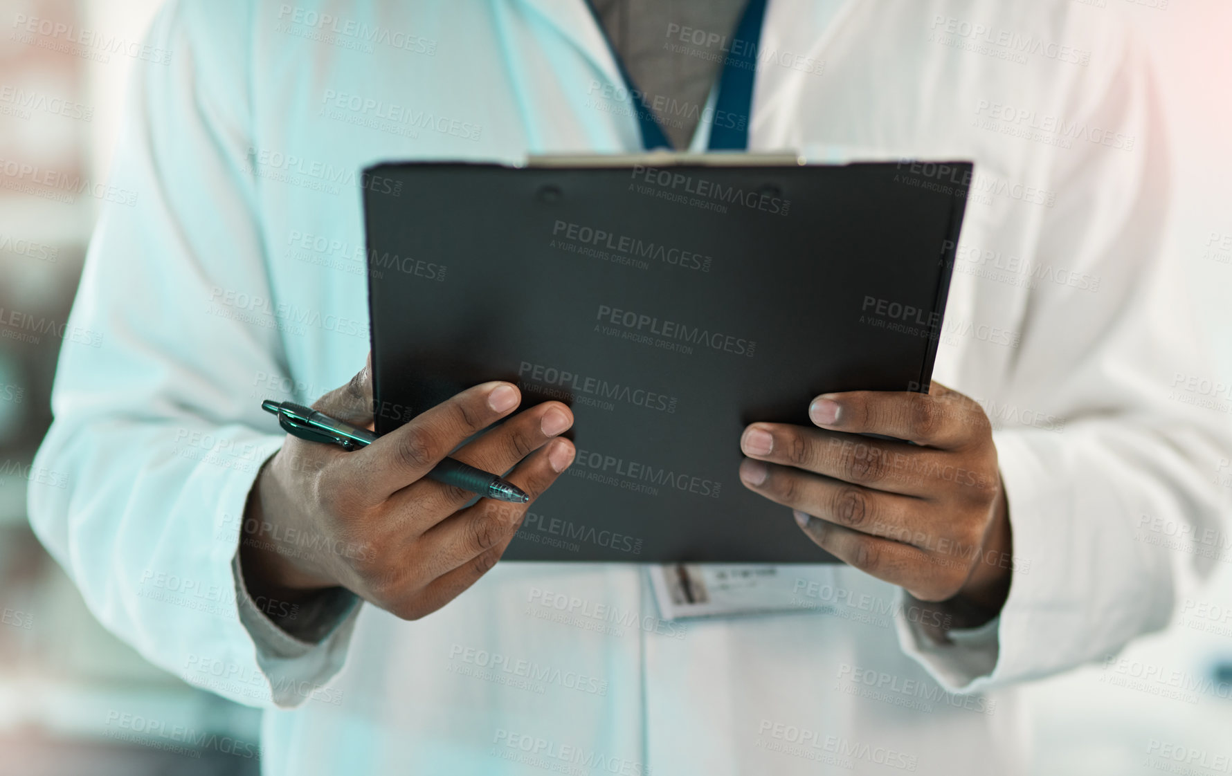 Buy stock photo Closeup shot of an unrecognisable scientist holding a clipboard in a lab