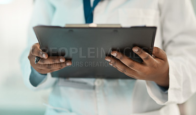 Buy stock photo Closeup shot of an unrecognisable scientist holding a clipboard in a lab