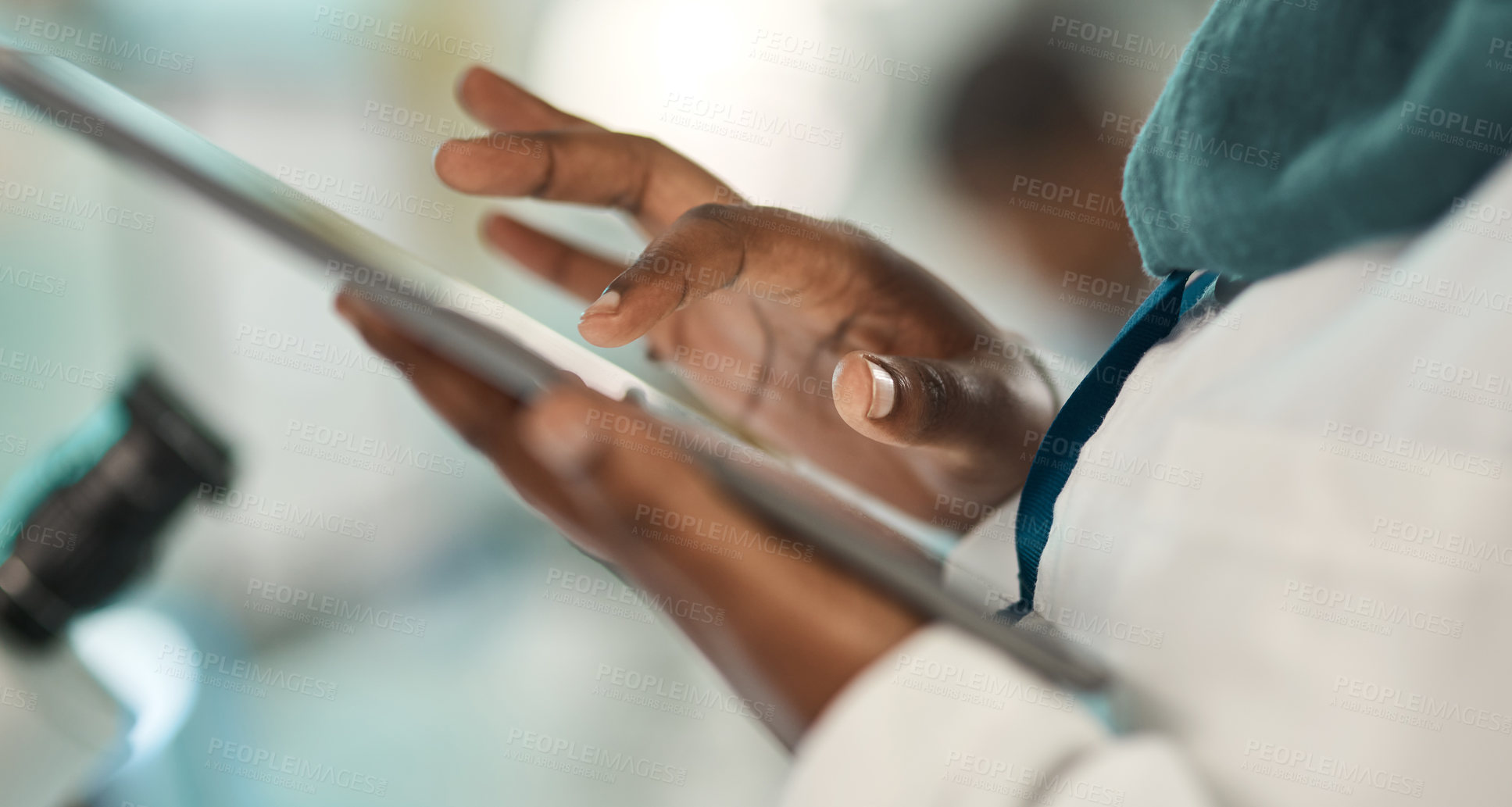 Buy stock photo Closeup shot of an unrecognisable scientist using a digital tablet in a lab