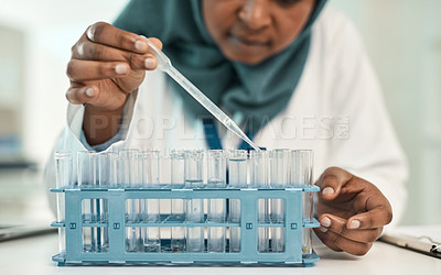 Buy stock photo Closeup shot of an unrecognisable scientist working with samples in a lab