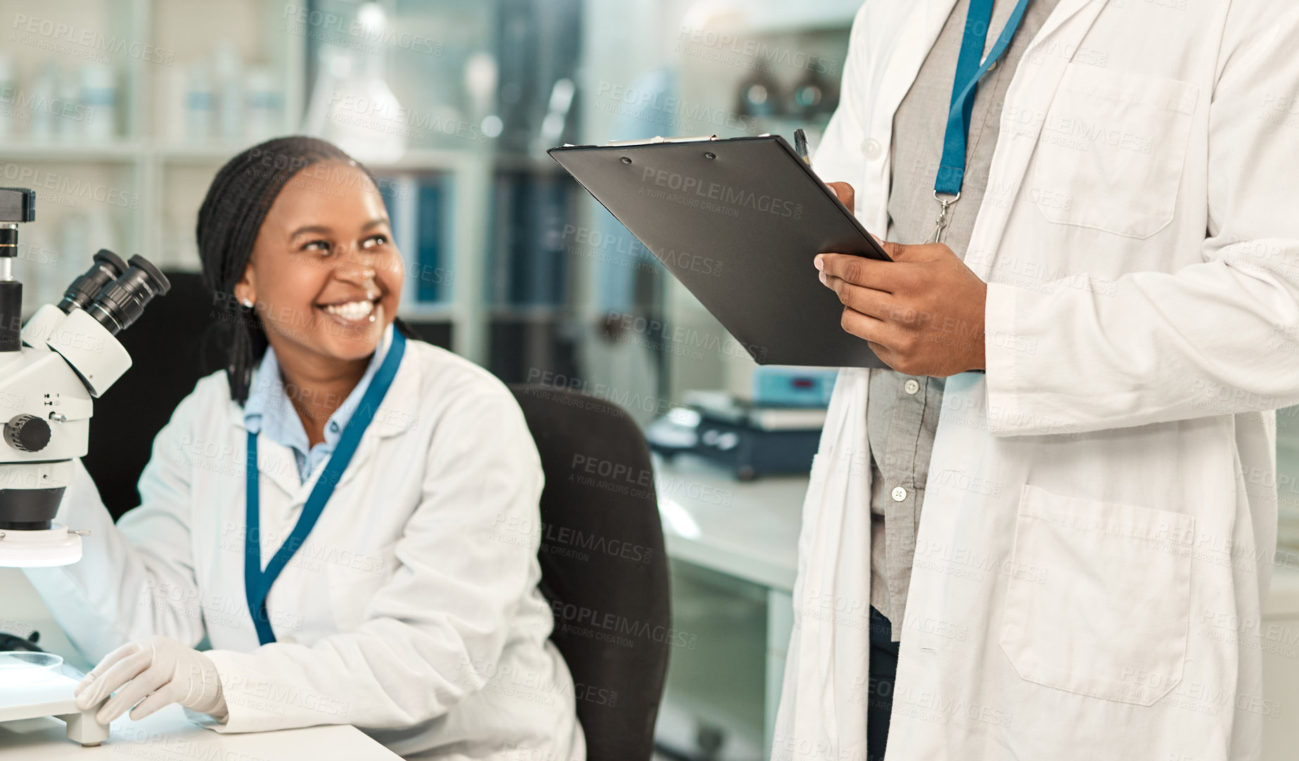 Buy stock photo Shot of two scientists working together in a lab