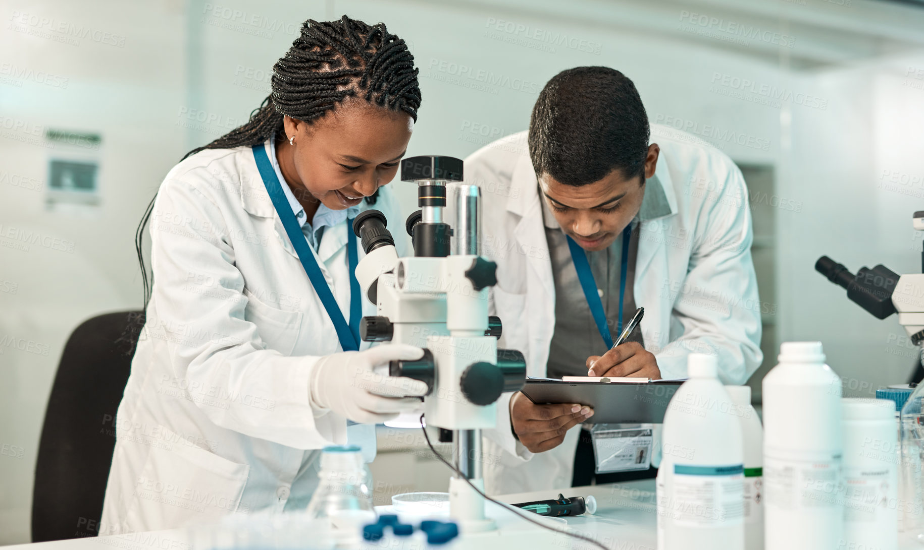 Buy stock photo Shot of two scientists working together in a lab