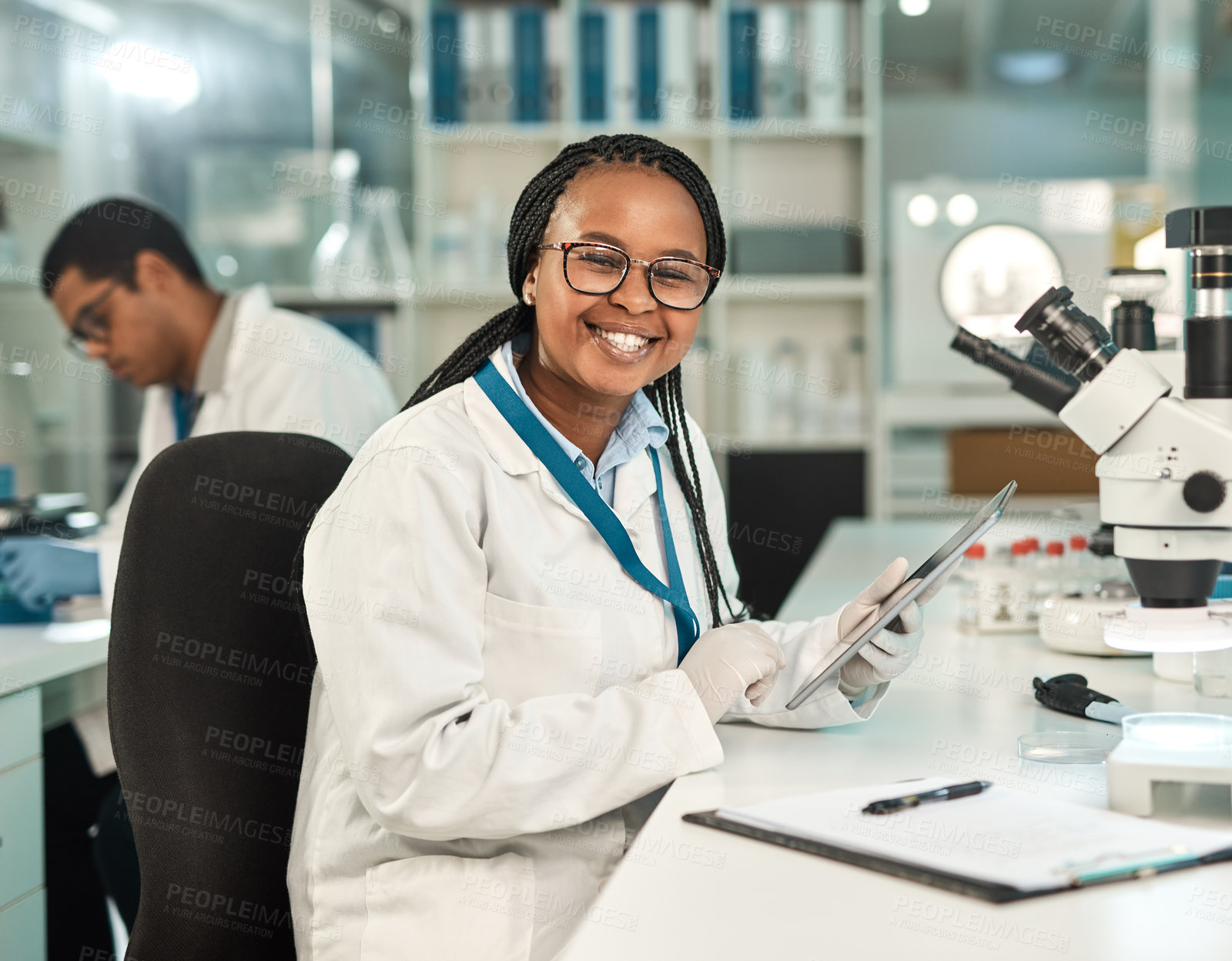 Buy stock photo Portrait of a young scientist using a digital tablet in a lab