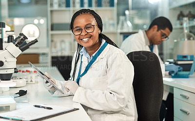 Buy stock photo Portrait of a young scientist using a digital tablet in a lab