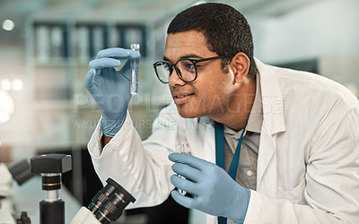 Buy stock photo Shot of a young scientist working with samples in a lab