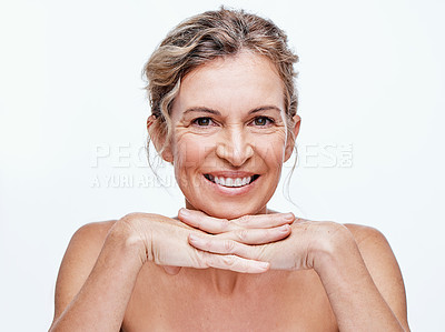 Buy stock photo Shot of a beautiful mature woman posing against a white background