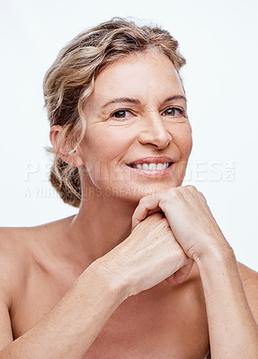 Buy stock photo Shot of a beautiful mature woman posing against a white background