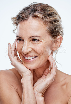Buy stock photo Shot of a beautiful mature woman posing against a white background