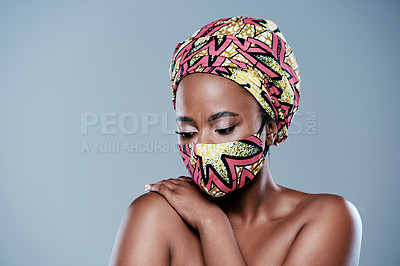 Buy stock photo Studio shot of a beautiful young woman wearing a mask against a grey background