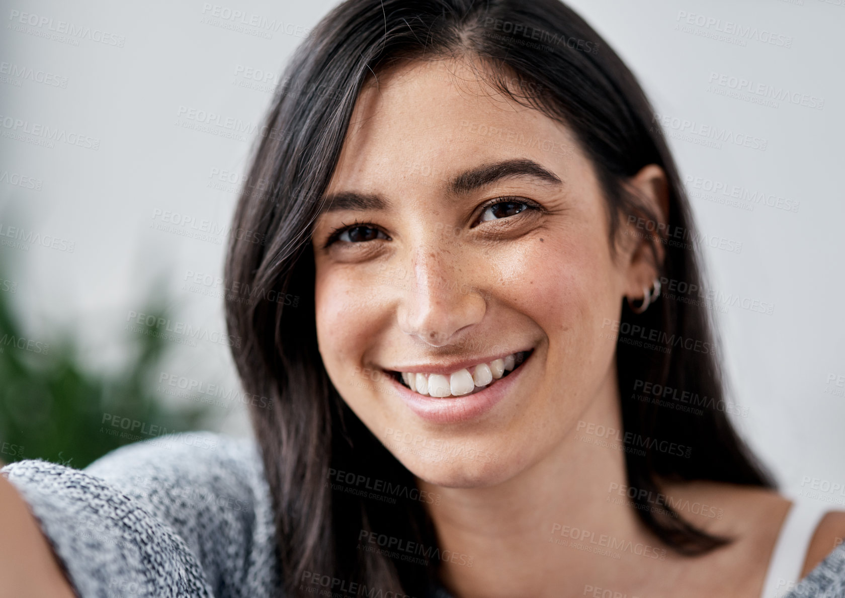 Buy stock photo Portrait of a happy young woman taking a selfie art home