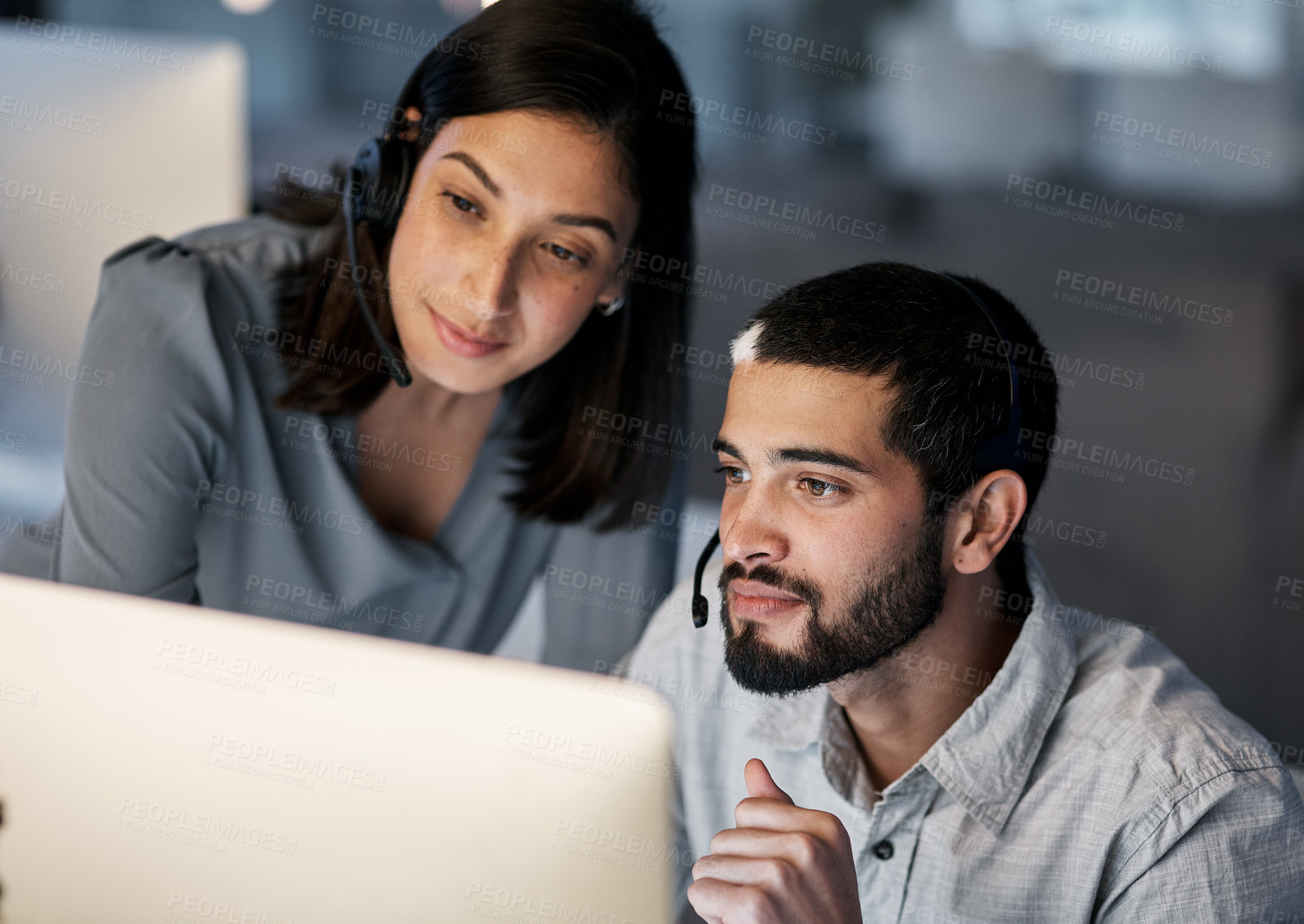 Buy stock photo Call center, team leader and computer for customer service, training of software and CRM in office. Focused man, woman and sales mentor helping intern on desktop, technical support and telemarketing