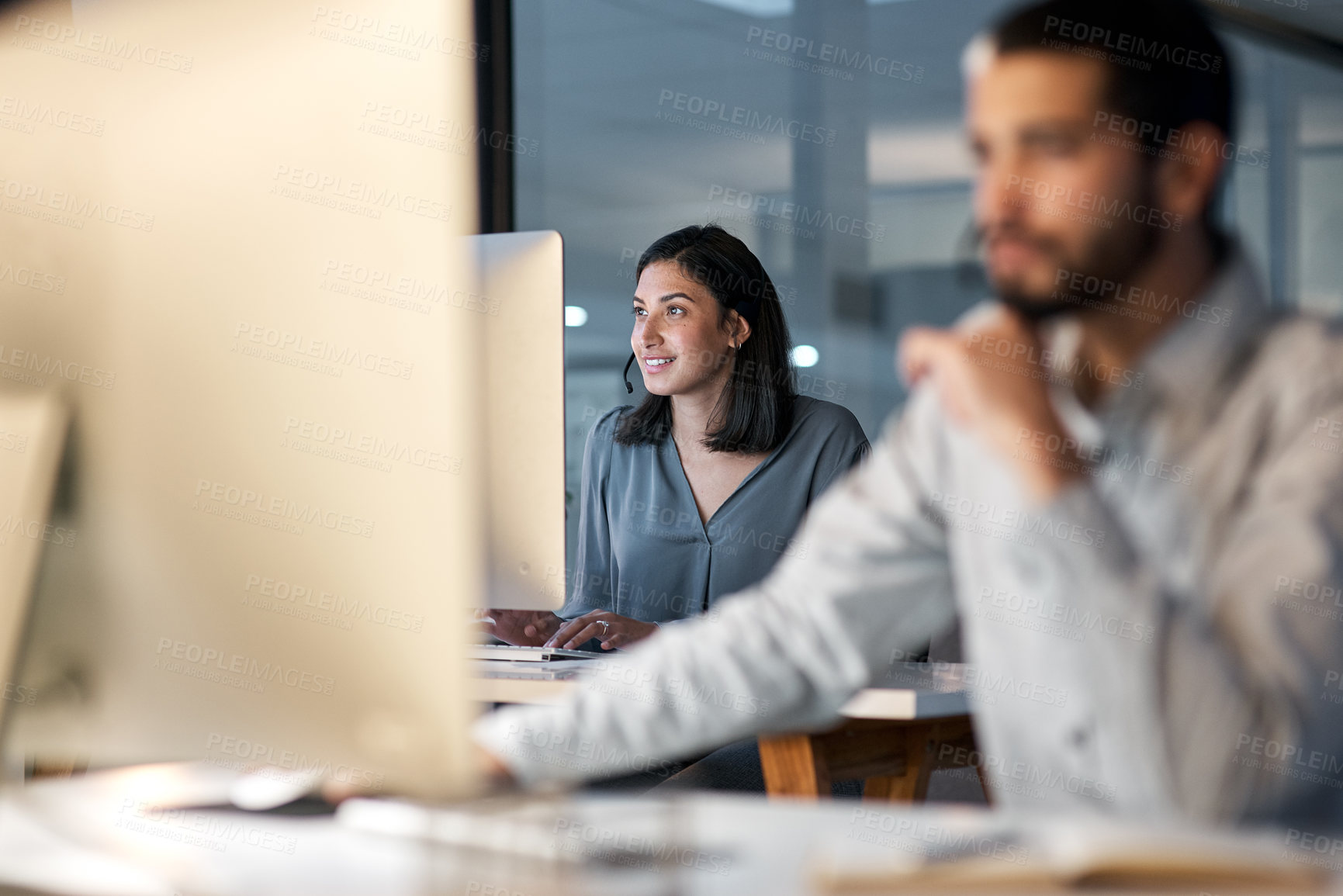 Buy stock photo Call center, woman and working at computer for customer service, telemarketing sales and consulting in coworking office. Female agent, desktop and communication for advice, questions and CRM at night