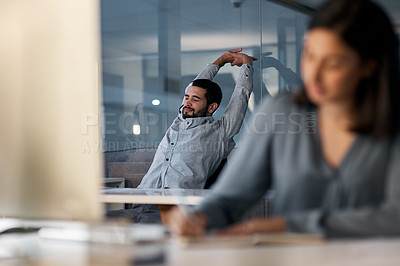 Buy stock photo Call center, tired man and stretching at computer desk for telemarketing support in coworking office at night. Lazy, sleepy and frustrated male agent with burnout, fatigue and bored of consulting 