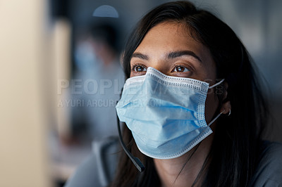 Buy stock photo Call center, woman and face mask at computer for customer service, technical support and CRM consulting in office. Female telemarketing agent with virus protection for online help, questions or sales