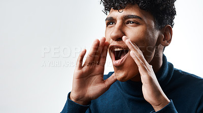 Buy stock photo Studio shot of a young man yelling against a grey background