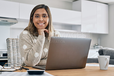 Buy stock photo Cropped shot of a woman using her laptop while working from home